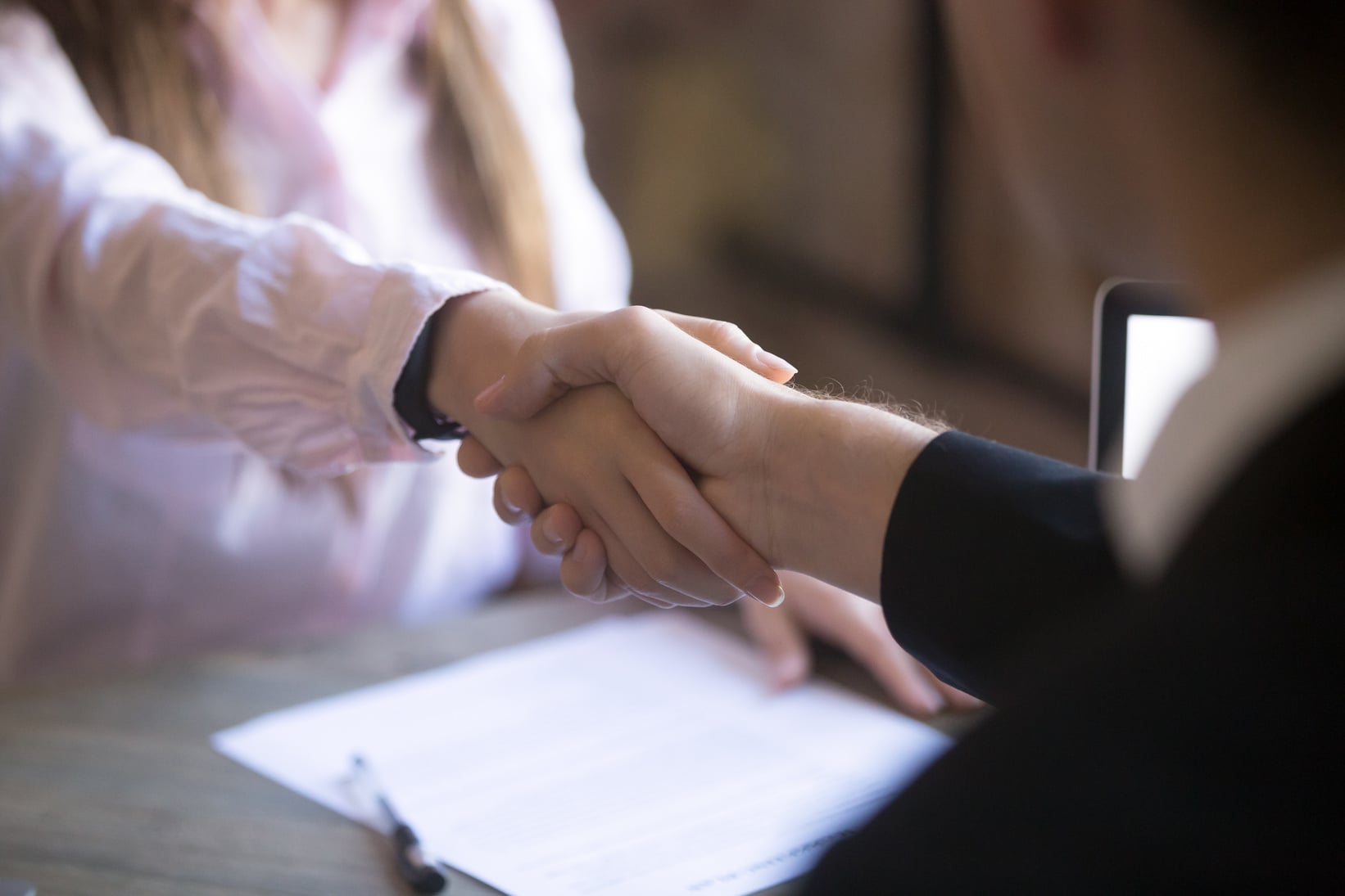 Handshake of man and woman